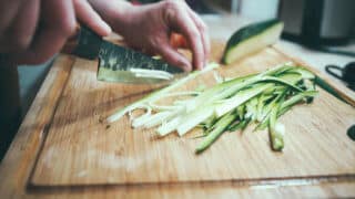 chopping cucumber into sticks